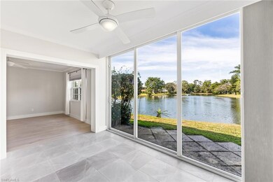 Sunroom with ceiling fan and an amazing water view