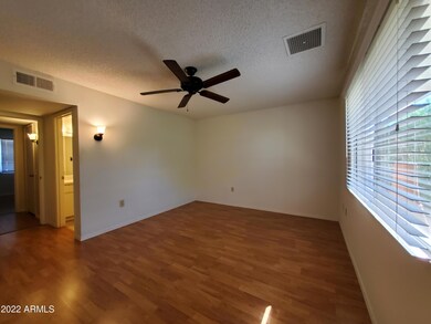 Primary bedroom offers en-suite bathroom and walk-in closet.