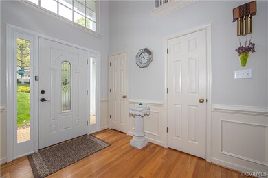 Foyer with light hardwood / wood-style flooring