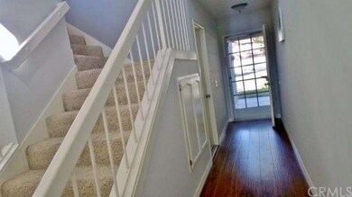 Entry hall, garage entry, stairwell to 2nd level