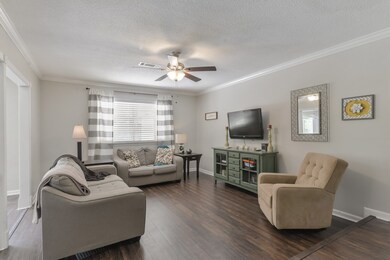 Large formal living area provides the perfect setting for relaxation and conversation with friends.