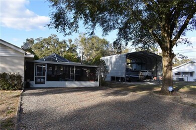 View of the screen enclosure and the Carport from 