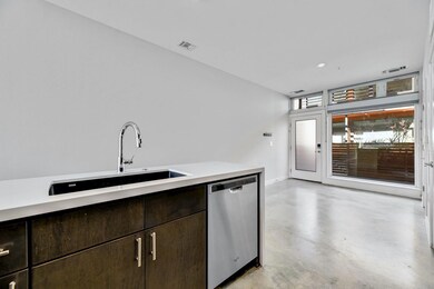 Kitchen with dishwasher, a sink, dark brown cabin