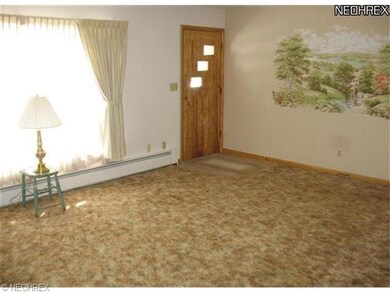 Large living room features lots of natural light.