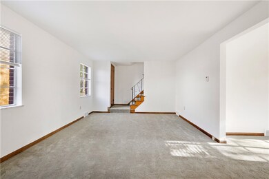 Enter the home into the large living room area.