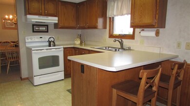 Newer Electric Smooth Top Range and Hood.