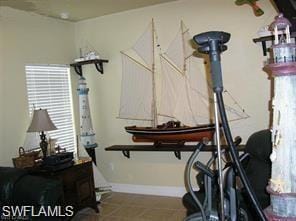 Exercise area featuring baseboards
