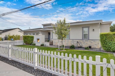 Home w/white picket fencing