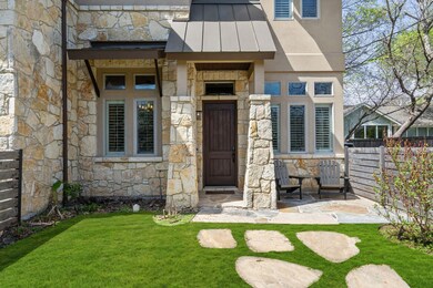 Property entrance with stone siding, a standing s