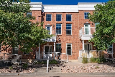 View of front of house with brick siding