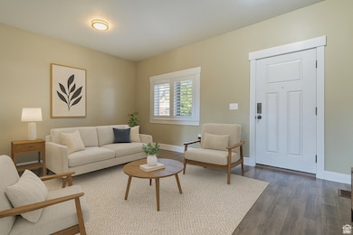 Living room featuring wood finished floors and baseboards