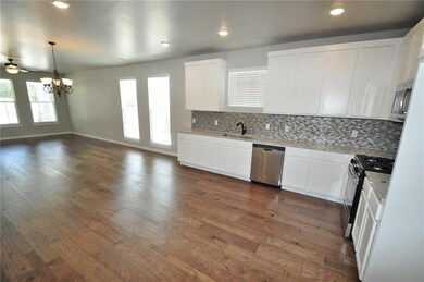 Kitchen  Another view of the bright kitchen featur