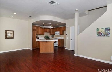 Huge open floor plan with laminate flooring on mai
