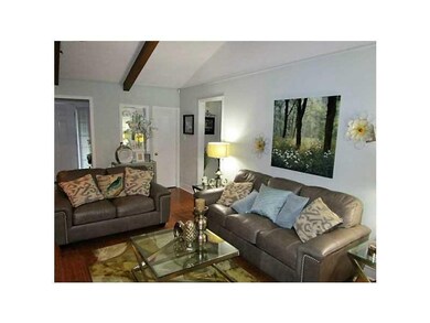Living Room. Cathedral ceiling with exposed beams.