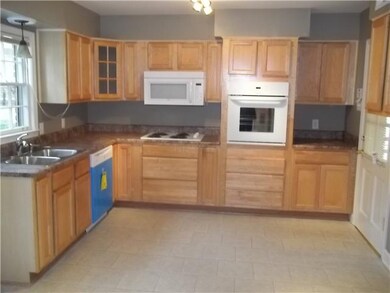 Kitchen area with new counter tops, ceramic tile f