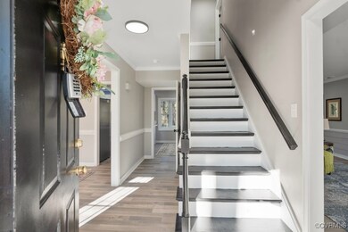 Stairway featuring hardwood / wood-style flooring