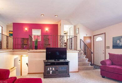 Front door opens to Living room. Level with Kitche