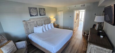 Bedroom with hardwood / wood-style flooring and a 