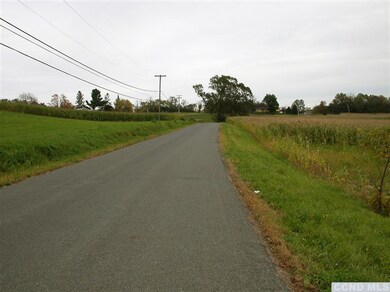 Sharptown Road travels through farmland. The land 