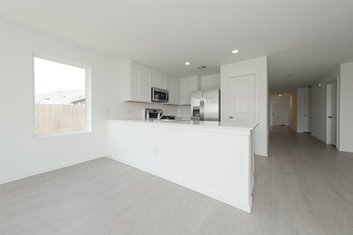 Kitchen and Front Door View from Living Room #2
