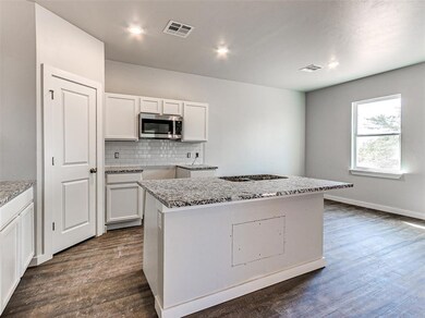 Granite, Stainless appliances and a pantry are inc