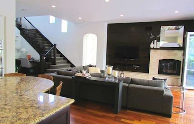 Family room with fireplace open to the Kitchen