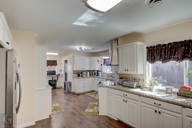 Huge updated kitchen. Granite counter tops. Plenty of beautiful cabinets