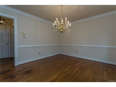 Dining Room with Chair Railing and Plantation Blin