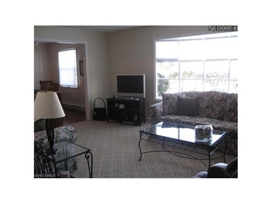 Another view of living room witn large window faci