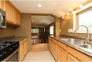 Galley kitchen in open floor plan is perfect for e