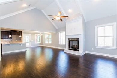 Vaulted ceiling with beams & gleaming hardwoods!