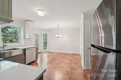 Kitchen leading to back deck.  Pantry to the right