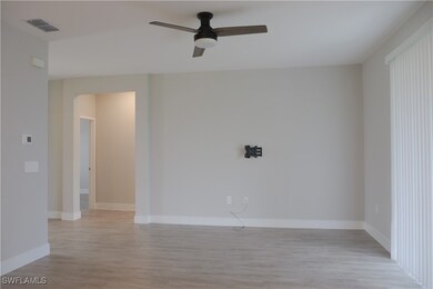Unfurnished room with visible vents, light wood-st