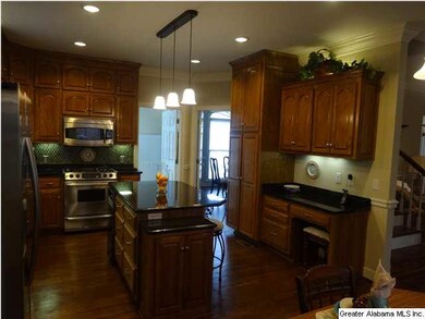 Island has breakfast bar, trash compactor, plenty 