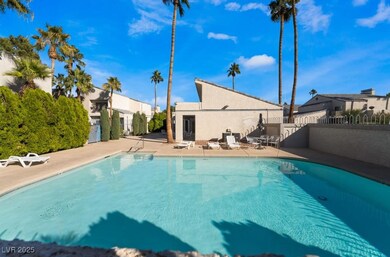 View of swimming pool with a patio area, a fenced