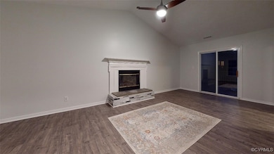 Unfurnished living room with dark wood finished fl