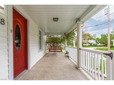 Front porch with porch swing and new railing