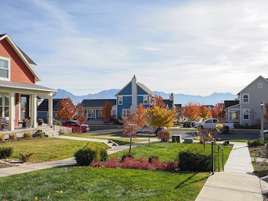 Surrounding community with a mountain view, a residential view, and a lawn