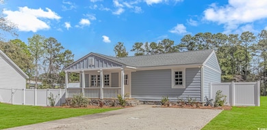 View of front facade featuring roof with shingles,