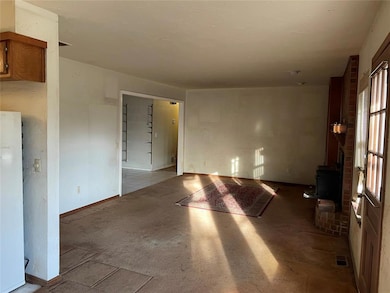 Unfurnished room with a wood stove