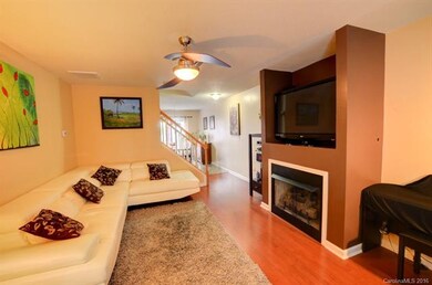 Spacious living room w/ gas log fireplace & nice l