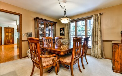 Gracious dining room with chair rail and updated l