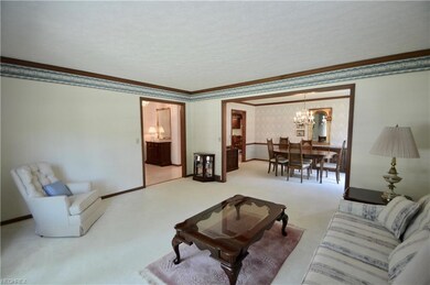 Living room view open to dining room