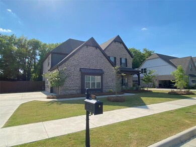 Large 2 car garage with extra driveway parking.