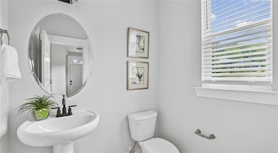 Half bath with toilet and a sink