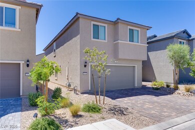 View of front of house featuring stucco siding, an