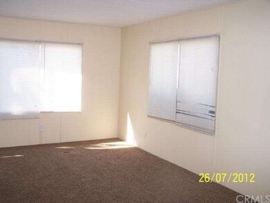 large living room with new carpet and paint