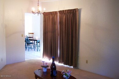 Living room detail shows door to porch