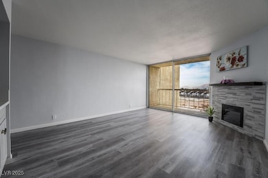 Unfurnished living room with a wall of windows, da