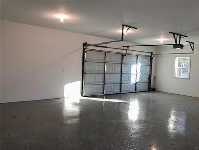 Epoxy flooring,  dry walled and insulated garage w